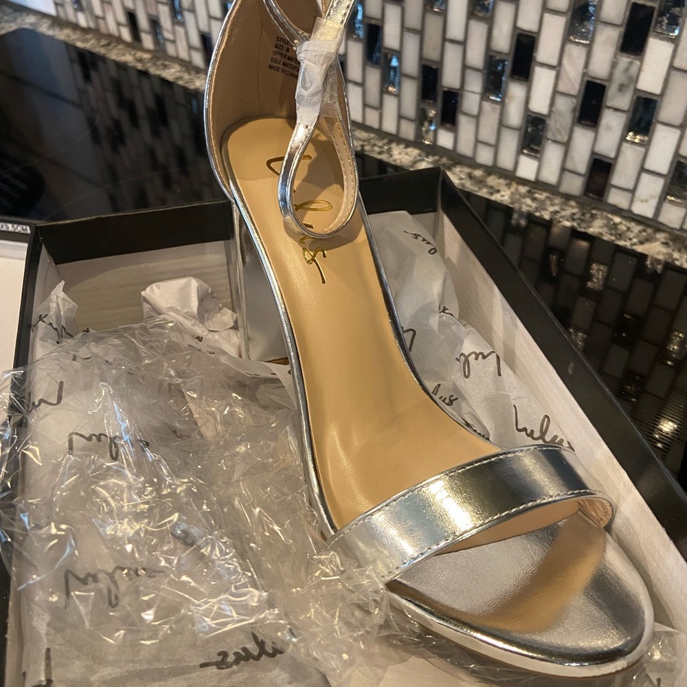 LuLu’s Silver Taylor Ankle Strap Heels. Never been worn.